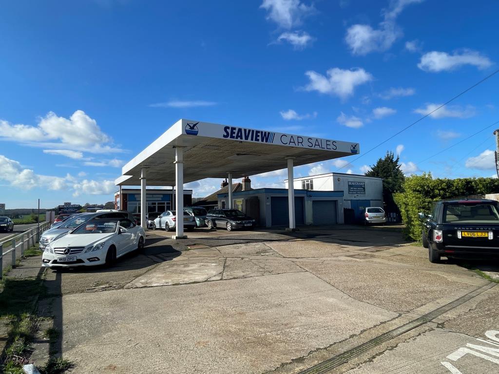Lot: 73 - FORMER SERVICE STATION/CAR SALES SITE WITH BUNGALOW & WORKSHOPS, OFFERING POTENTIAL - Forecourt with garages and parking